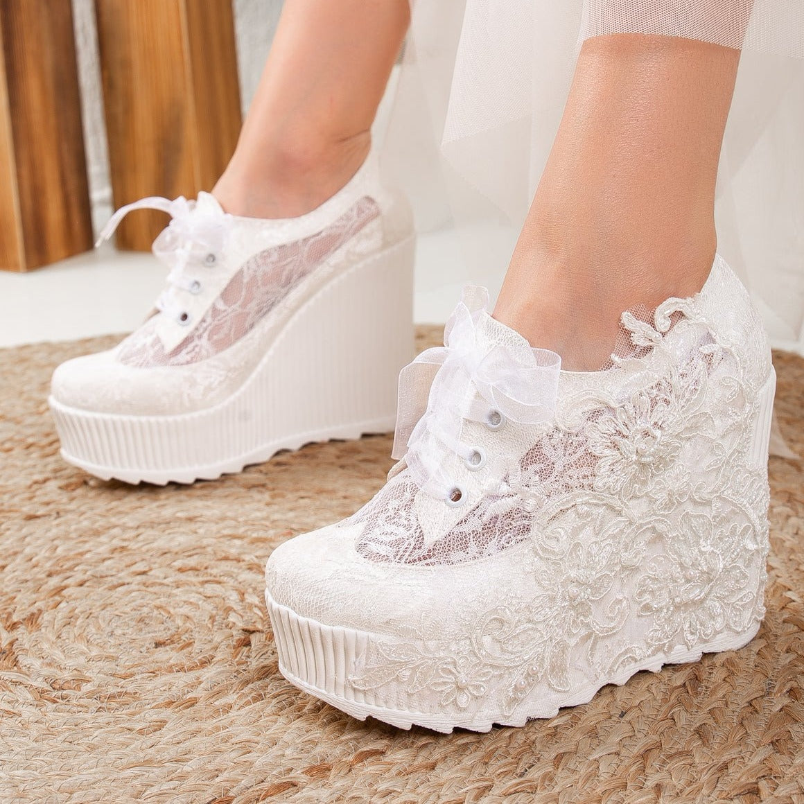 White wedding sneakers, Bridal sneakers in white, Wedding tennis shoes in white, White bridal trainers, White lace-up wedding sneakers, White canvas bridal sneakers, White platform wedding sneakers, White embellished wedding sneakers, White high-top wedding sneakers, White slip-on bridal sneakers.