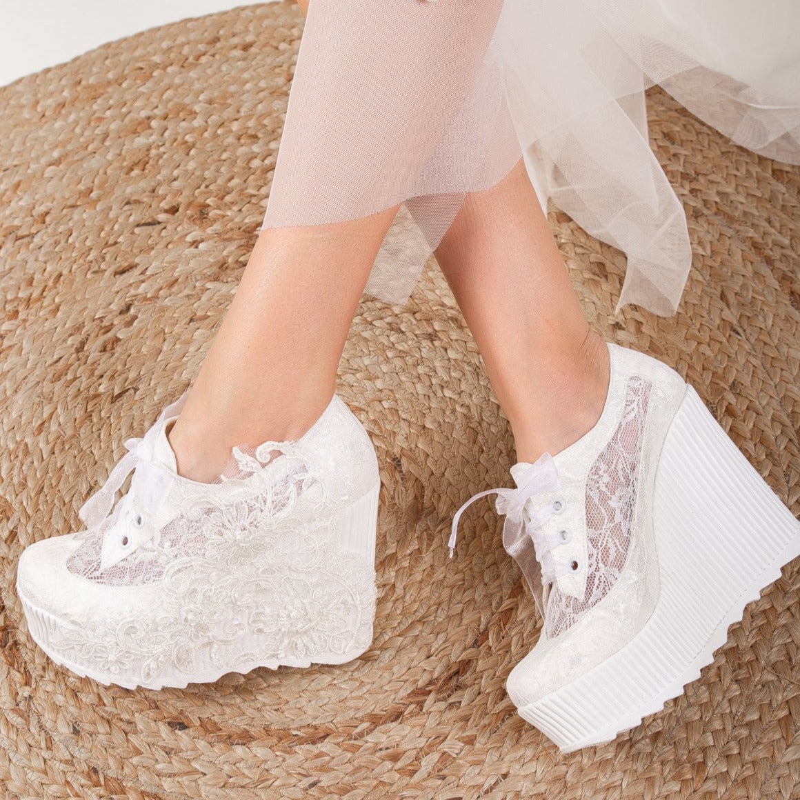 White wedding sneakers, Bridal sneakers in white, Wedding tennis shoes in white, White bridal trainers, White lace-up wedding sneakers, White canvas bridal sneakers, White platform wedding sneakers, White embellished wedding sneakers, White high-top wedding sneakers, White slip-on bridal sneakers.