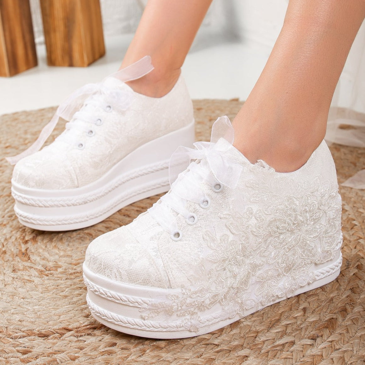 White wedding sneakers, Bridal sneakers in white, Wedding tennis shoes in white, White bridal trainers, White lace-up wedding sneakers, White canvas bridal sneakers, White platform wedding sneakers, White embellished wedding sneakers, White high-top wedding sneakers, White slip-on bridal sneakers.