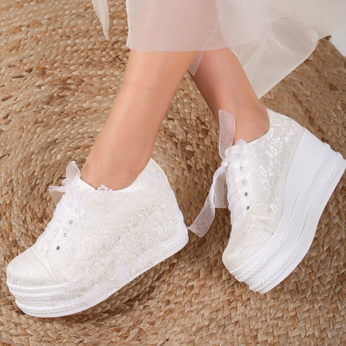 White wedding sneakers, Bridal sneakers in white, Wedding tennis shoes in white, White bridal trainers, White lace-up wedding sneakers, White canvas bridal sneakers, White platform wedding sneakers, White embellished wedding sneakers, White high-top wedding sneakers, White slip-on bridal sneakers.