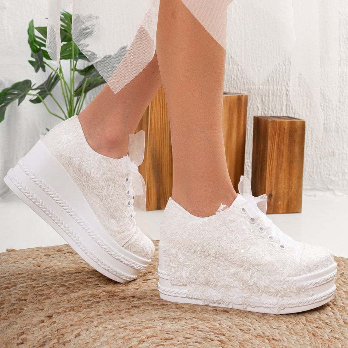 White wedding sneakers, Bridal sneakers in white, Wedding tennis shoes in white, White bridal trainers, White lace-up wedding sneakers, White canvas bridal sneakers, White platform wedding sneakers, White embellished wedding sneakers, White high-top wedding sneakers, White slip-on bridal sneakers.