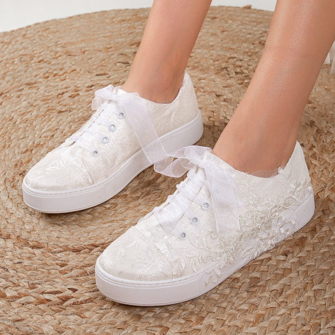 White wedding sneakers, Bridal sneakers in white, Wedding tennis shoes in white, White bridal trainers, White lace-up wedding sneakers, White canvas bridal sneakers, White platform wedding sneakers, White embellished wedding sneakers, White high-top wedding sneakers, White slip-on bridal sneakers.