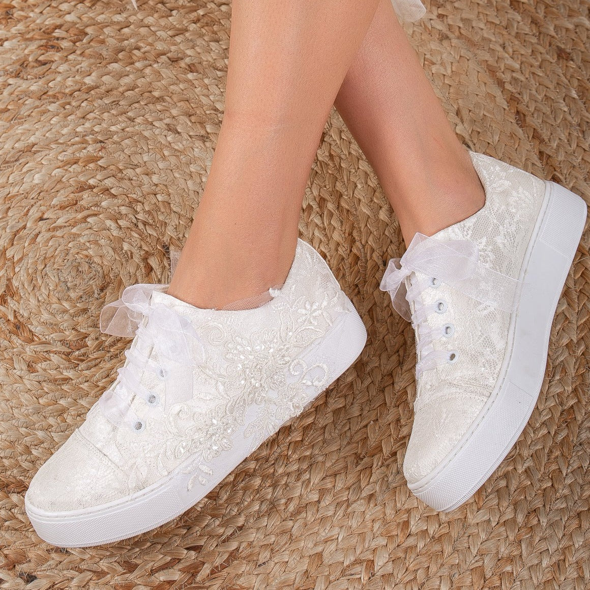 White wedding sneakers, Bridal sneakers in white, Wedding tennis shoes in white, White bridal trainers, White lace-up wedding sneakers, White canvas bridal sneakers, White platform wedding sneakers, White embellished wedding sneakers, White high-top wedding sneakers, White slip-on bridal sneakers.