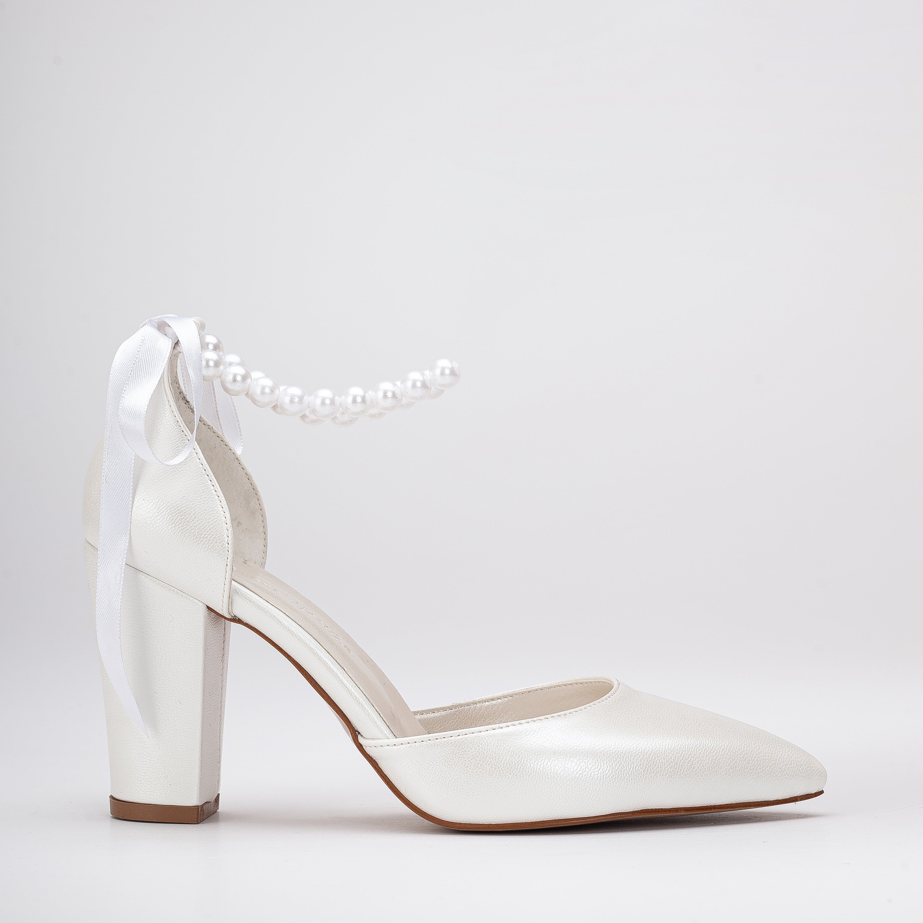 Ivory high heels, High heeled ivory shoes, Ivory stilettos, High heeled pumps in ivory, Ivory platform heels, Ivory high heel sandals, Ivory dress heels, Ivory evening heels, High heeled ivory footwear, Ivory formal heels.