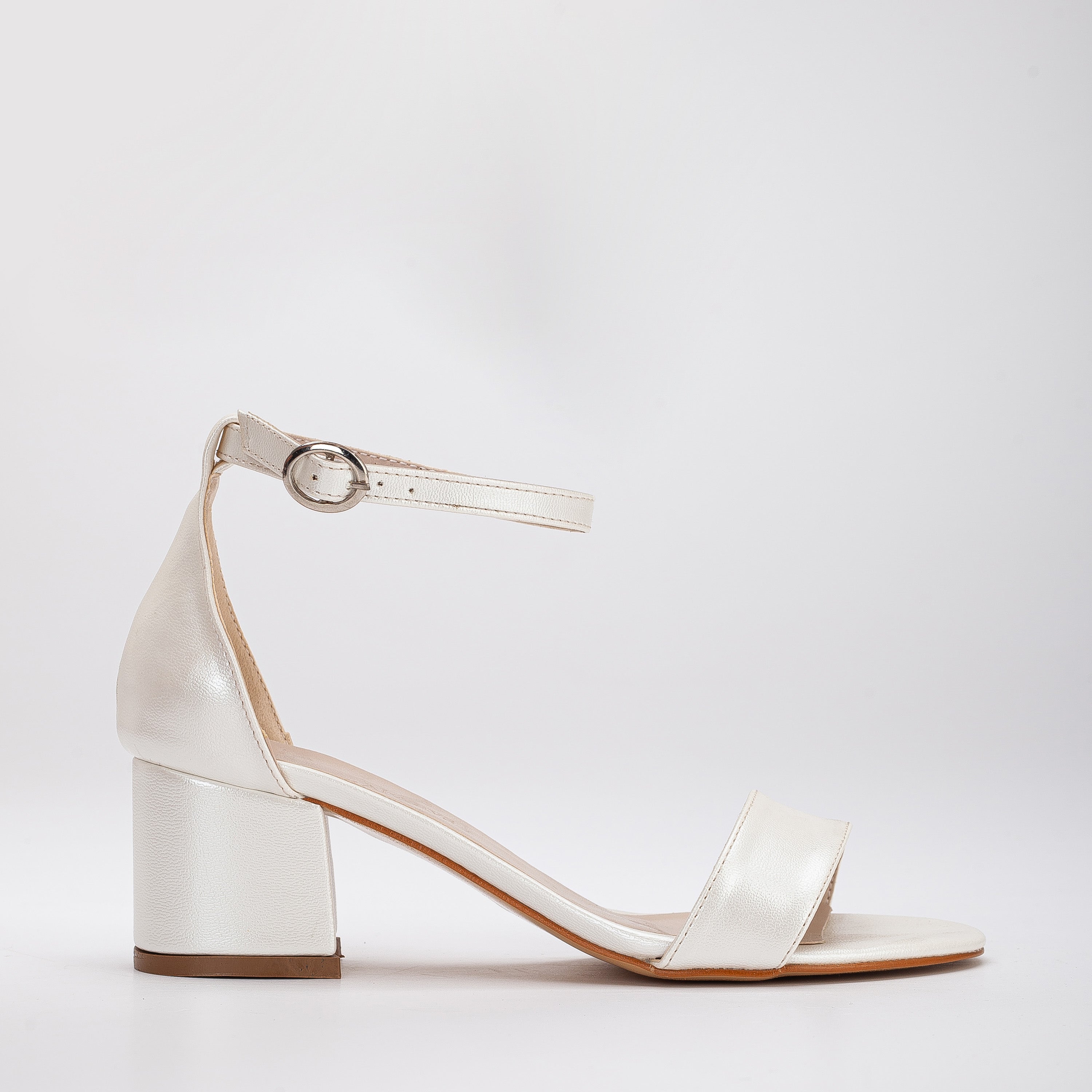 Ivory white sandals, White sandals in ivory, Stylish ivory white shoes, Chic white sandals, Trendy ivory white footwear, Fashionable white sandals, Elegant ivory white heels, Classic white sandals, Comfortable ivory white shoes, Ivory white sandals for women.