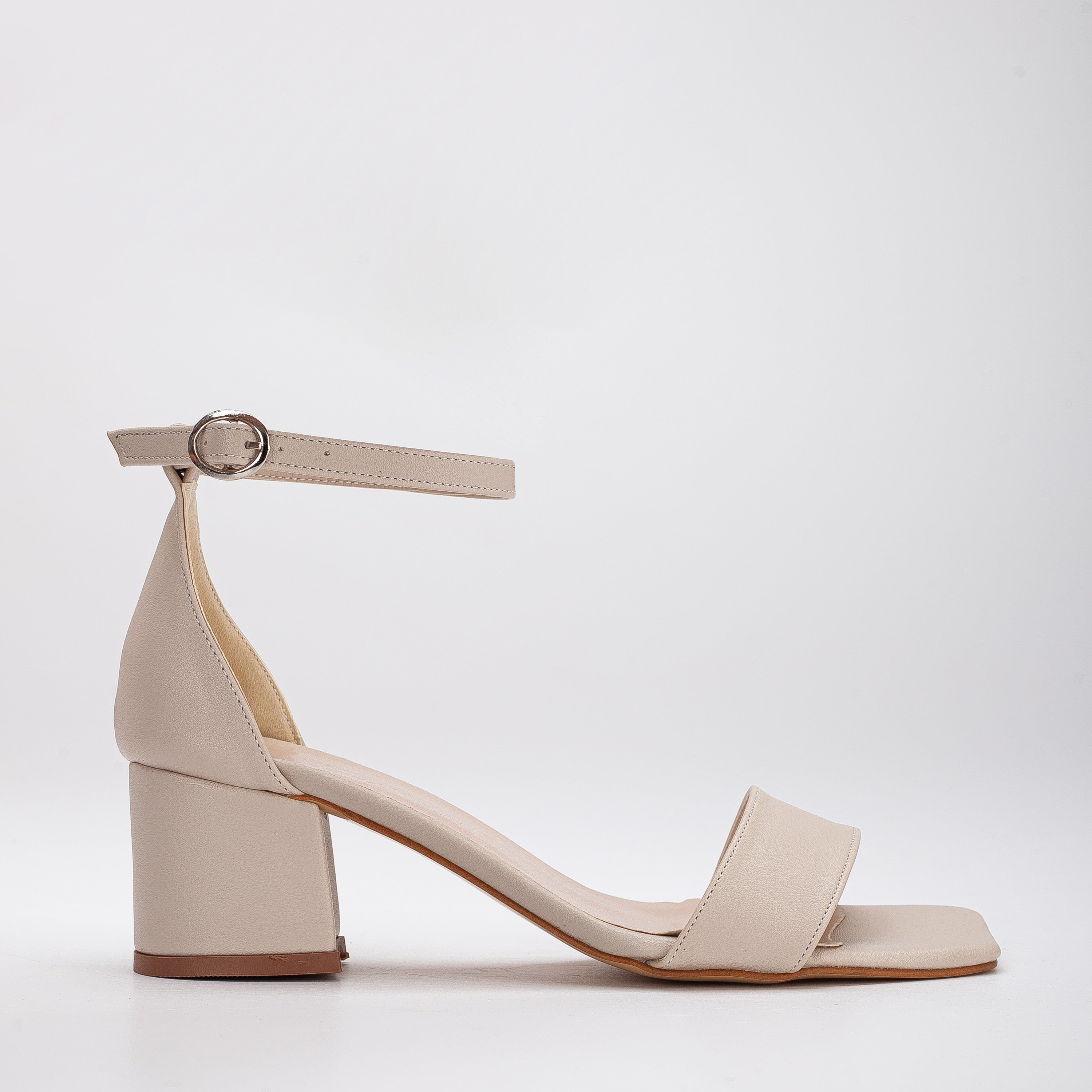 Beige low heel sandals, Low heel sandals in beige, Stylish beige low heel shoes, Chic low heel sandals, Trendy beige low heel footwear, Fashionable low heel sandals, Elegant beige low heel shoes, Classic low heel sandals, Comfortable beige low heel footwear, Beige low heel sandals for women.