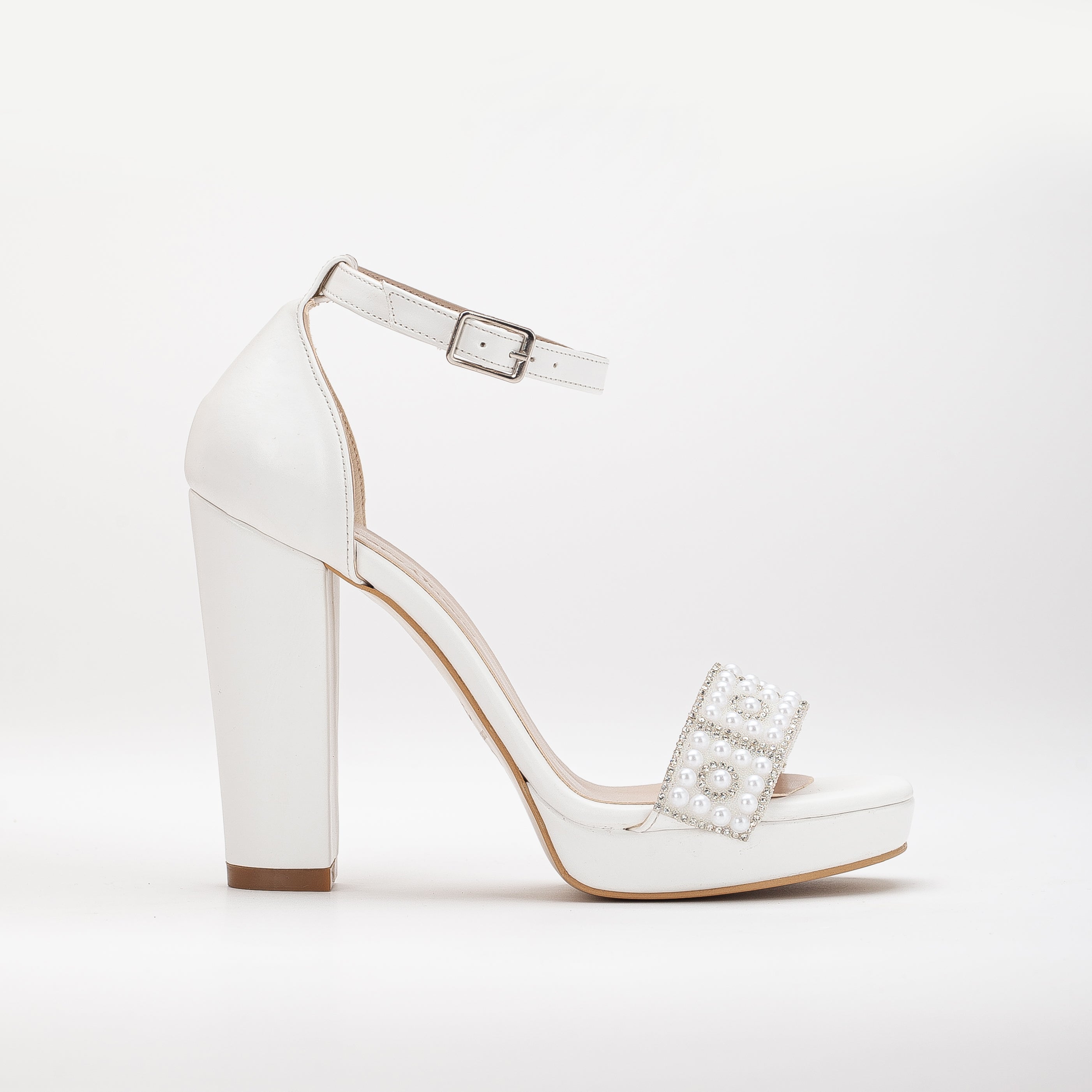 White platform bridal heels, high platform wedding shoes, elegant white bridal heels, tall platform bridal sandals, ivory platform wedding pumps, lace-up platform bridal heels, sparkling white platform shoes, peep-toe platform wedding heels, strappy platform bridal sandals, embellished platform bridal pumps.