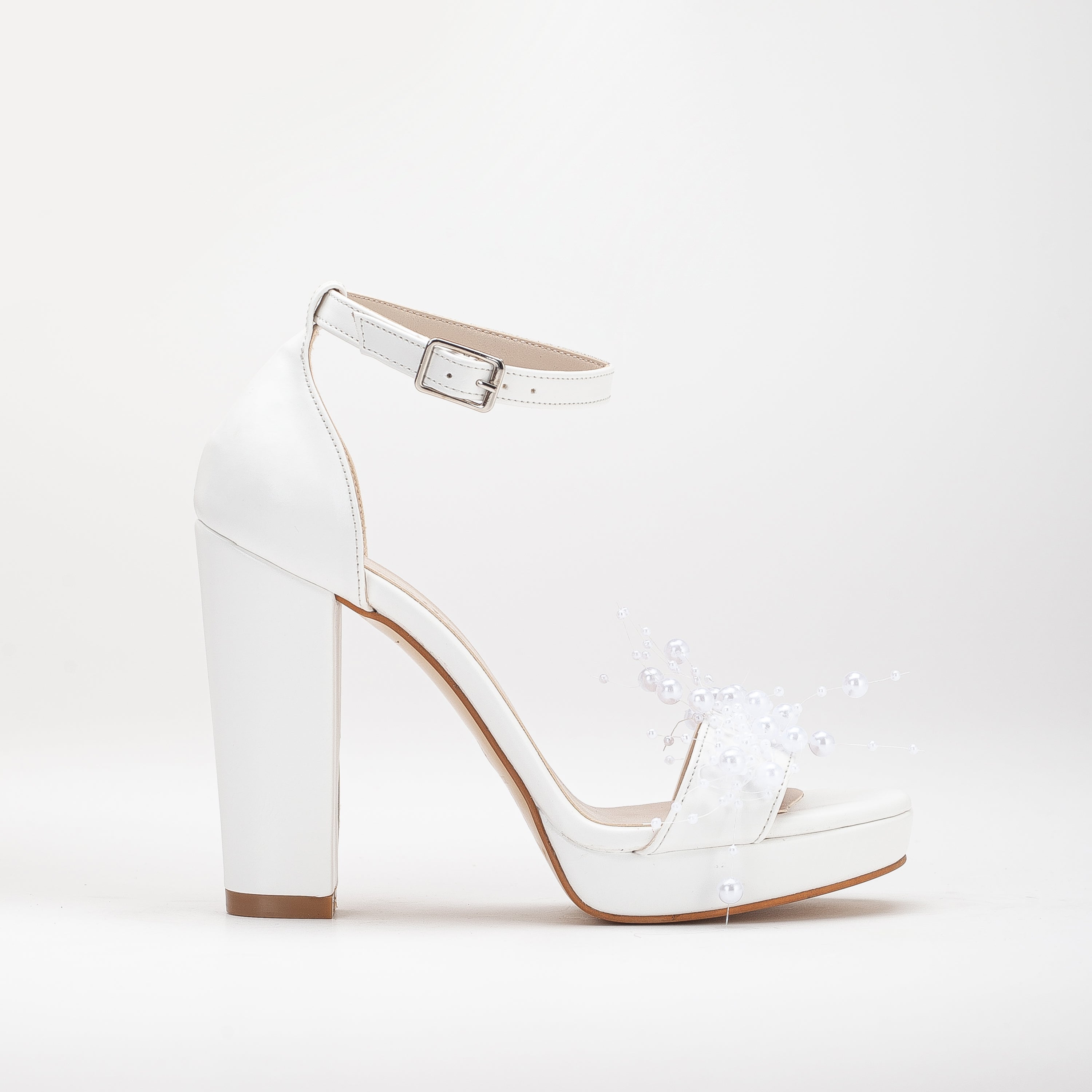 White platform bridal heels, high platform wedding shoes, elegant white bridal heels, tall platform bridal sandals, ivory platform wedding pumps, lace-up platform bridal heels, sparkling white platform shoes, peep-toe platform wedding heels, strappy platform bridal sandals, embellished platform bridal pumps.