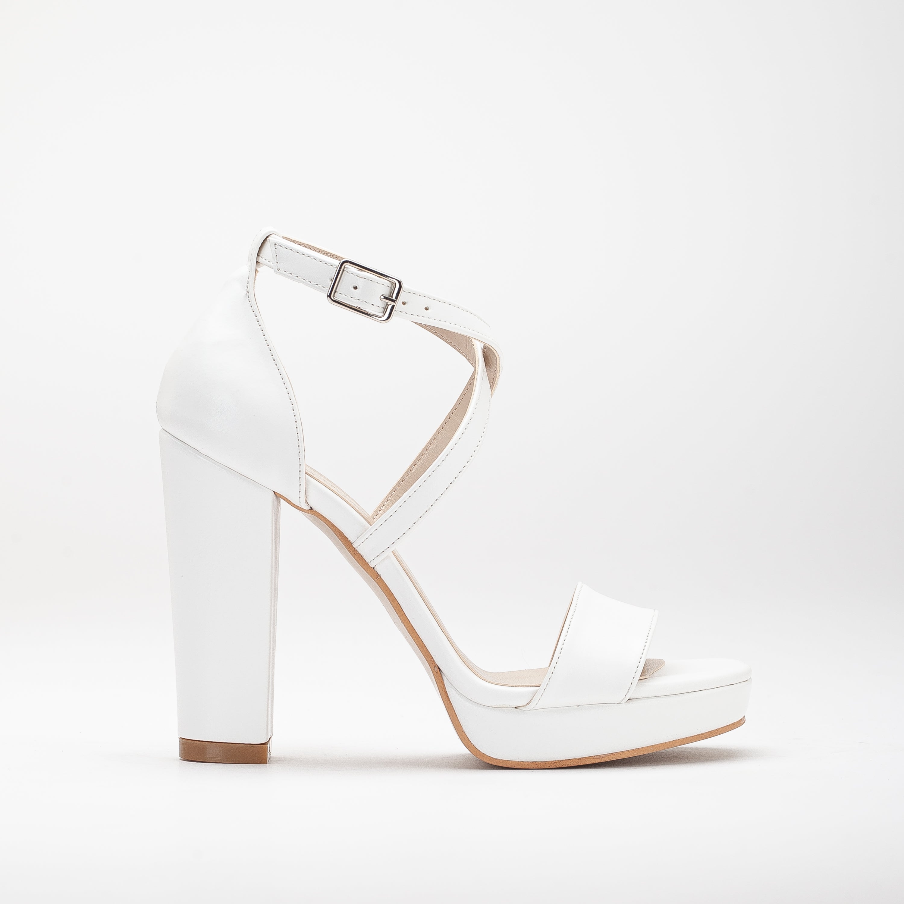 White platform bridal heels, high platform wedding shoes, elegant white bridal heels, tall platform bridal sandals, ivory platform wedding pumps, lace-up platform bridal heels, sparkling white platform shoes, peep-toe platform wedding heels, strappy platform bridal sandals, embellished platform bridal pumps.