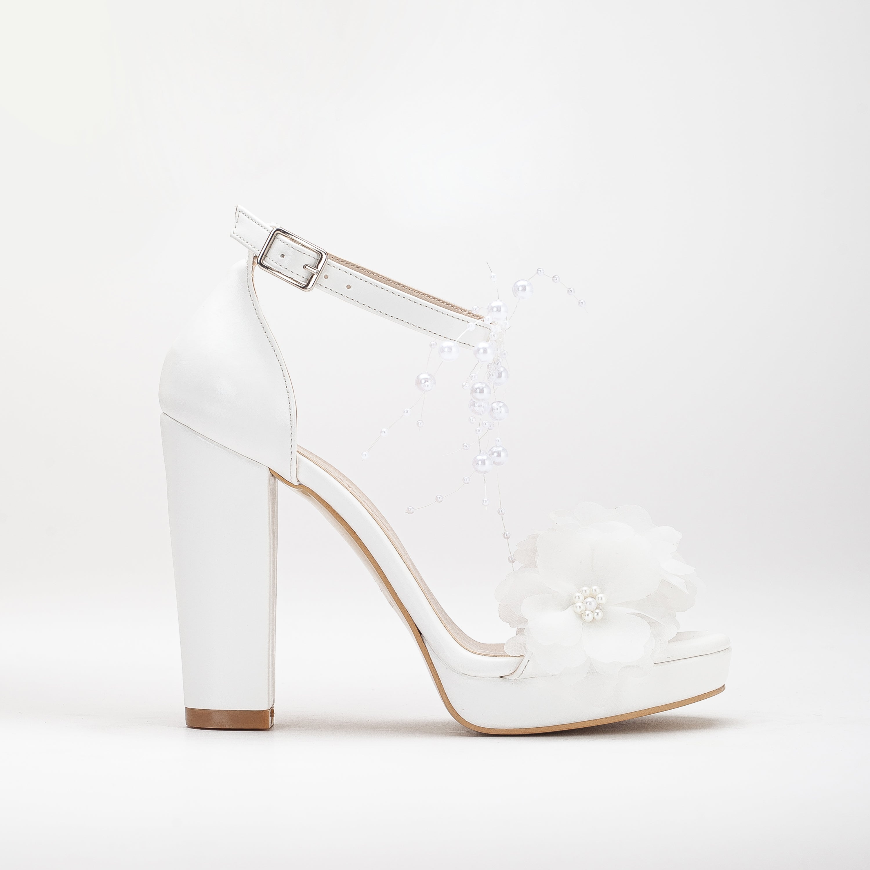 White platform bridal heels, high platform wedding shoes, elegant white bridal heels, tall platform bridal sandals, ivory platform wedding pumps, lace-up platform bridal heels, sparkling white platform shoes, peep-toe platform wedding heels, strappy platform bridal sandals, embellished platform bridal pumps.