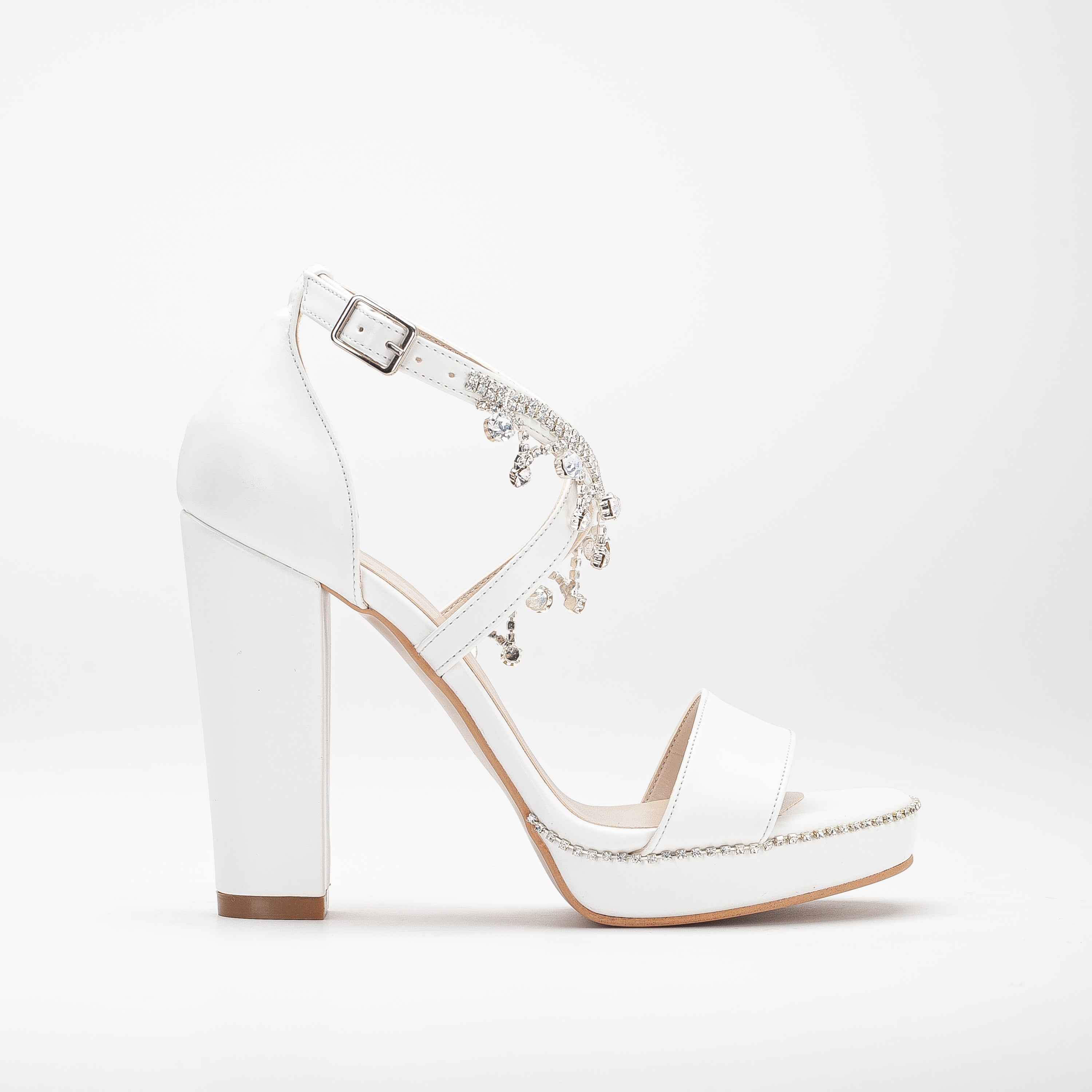 White platform bridal heels, high platform wedding shoes, elegant white bridal heels, tall platform bridal sandals, ivory platform wedding pumps, lace-up platform bridal heels, sparkling white platform shoes, peep-toe platform wedding heels, strappy platform bridal sandals, embellished platform bridal pumps.