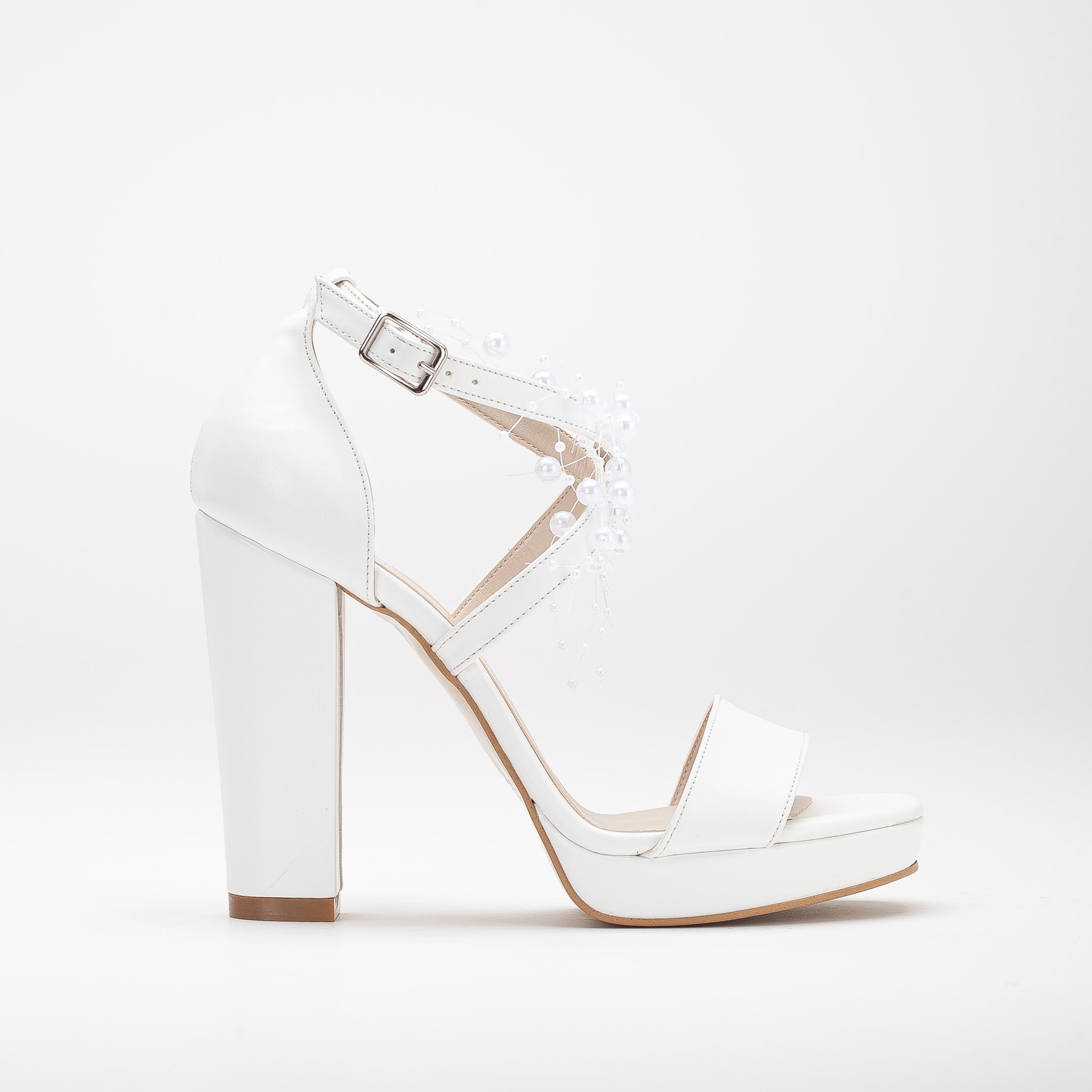 White platform bridal heels, high platform wedding shoes, elegant white bridal heels, tall platform bridal sandals, ivory platform wedding pumps, lace-up platform bridal heels, sparkling white platform shoes, peep-toe platform wedding heels, strappy platform bridal sandals, embellished platform bridal pumps.