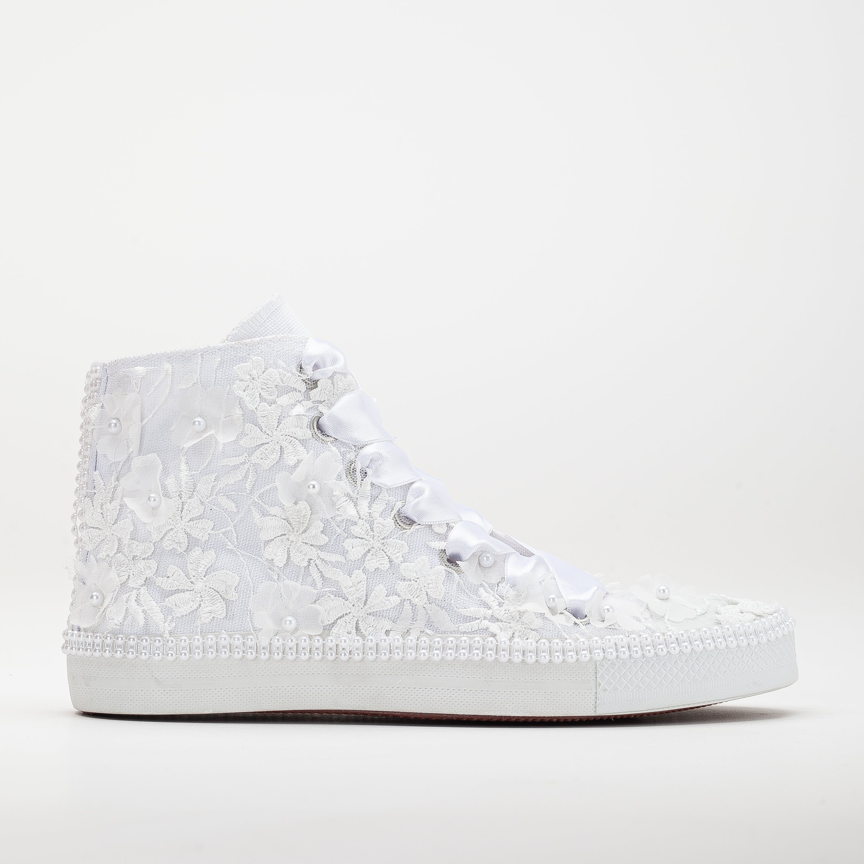 converse, white lace sneakers, lace-up white sneakers, white lace tennis shoes, lace detailed white sneakers, white lace casual shoes, white lace running shoes, women's white lace sneakers, white lace trainers, white lace slip-on sneakers, white lace fashion sneakers